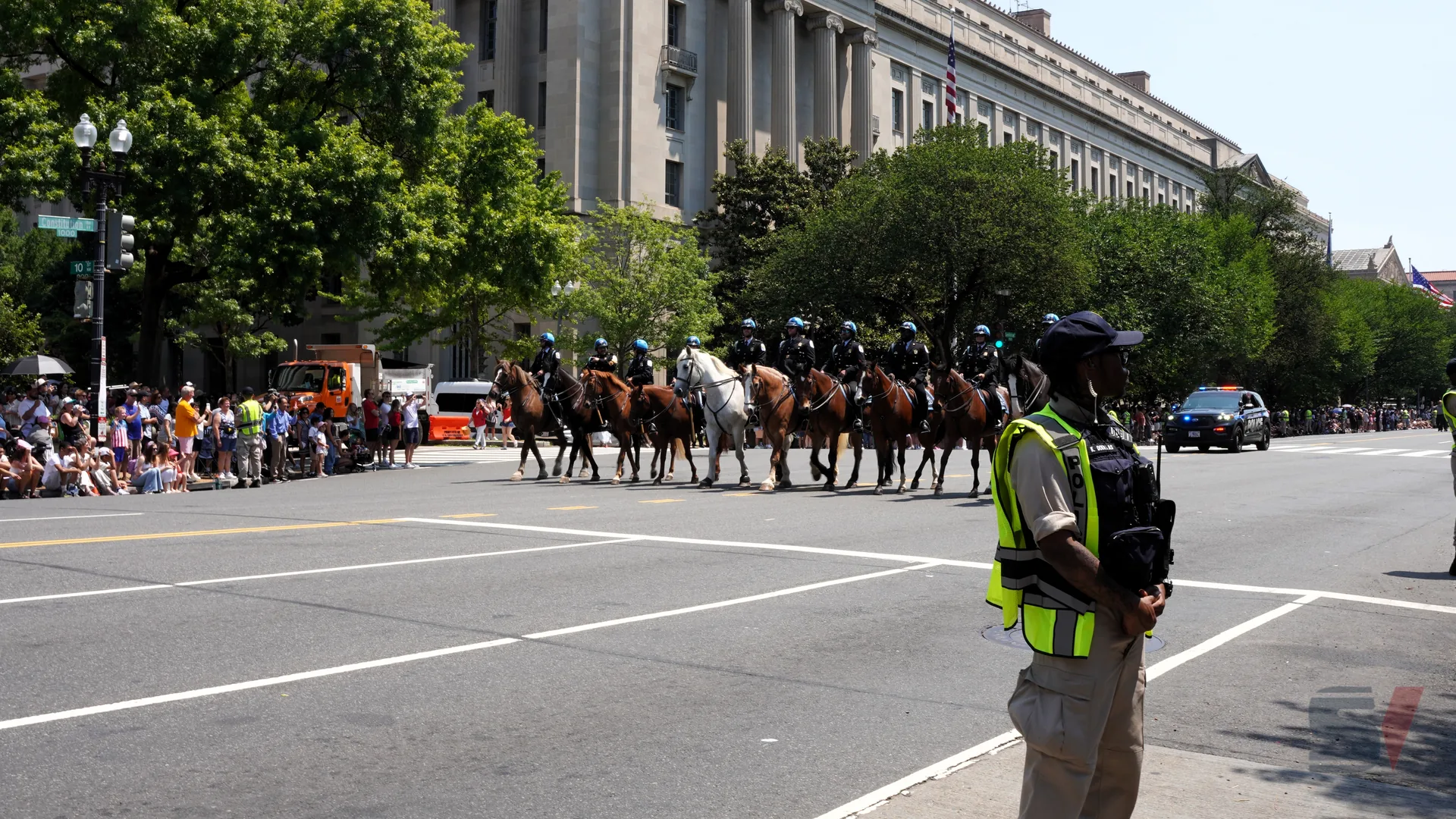Mounted police officers in uniform participate in the July 4th parade in Washington, D.C.