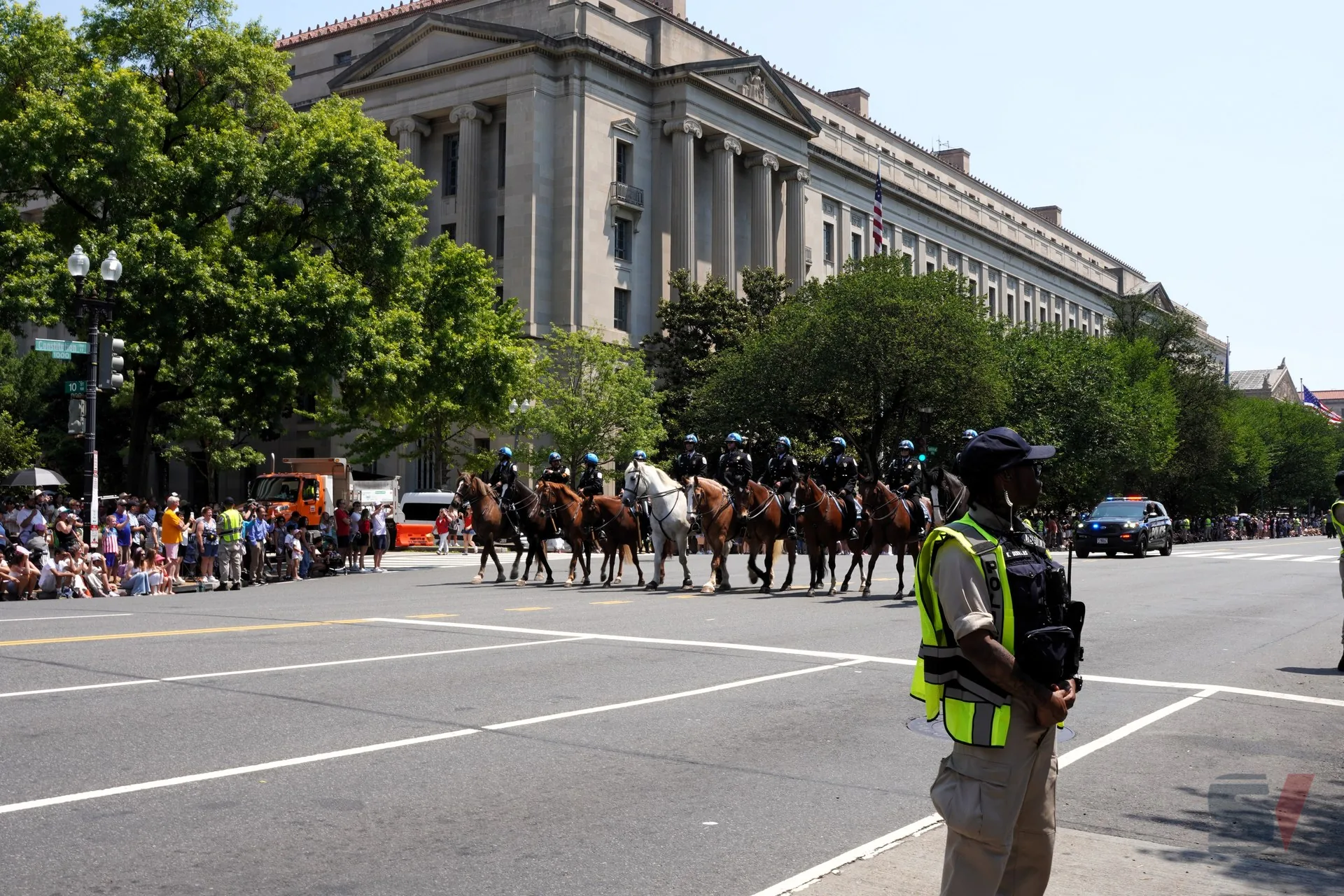 Mounted police officers in uniform participate in the July 4th parade in Washington, D.C.
