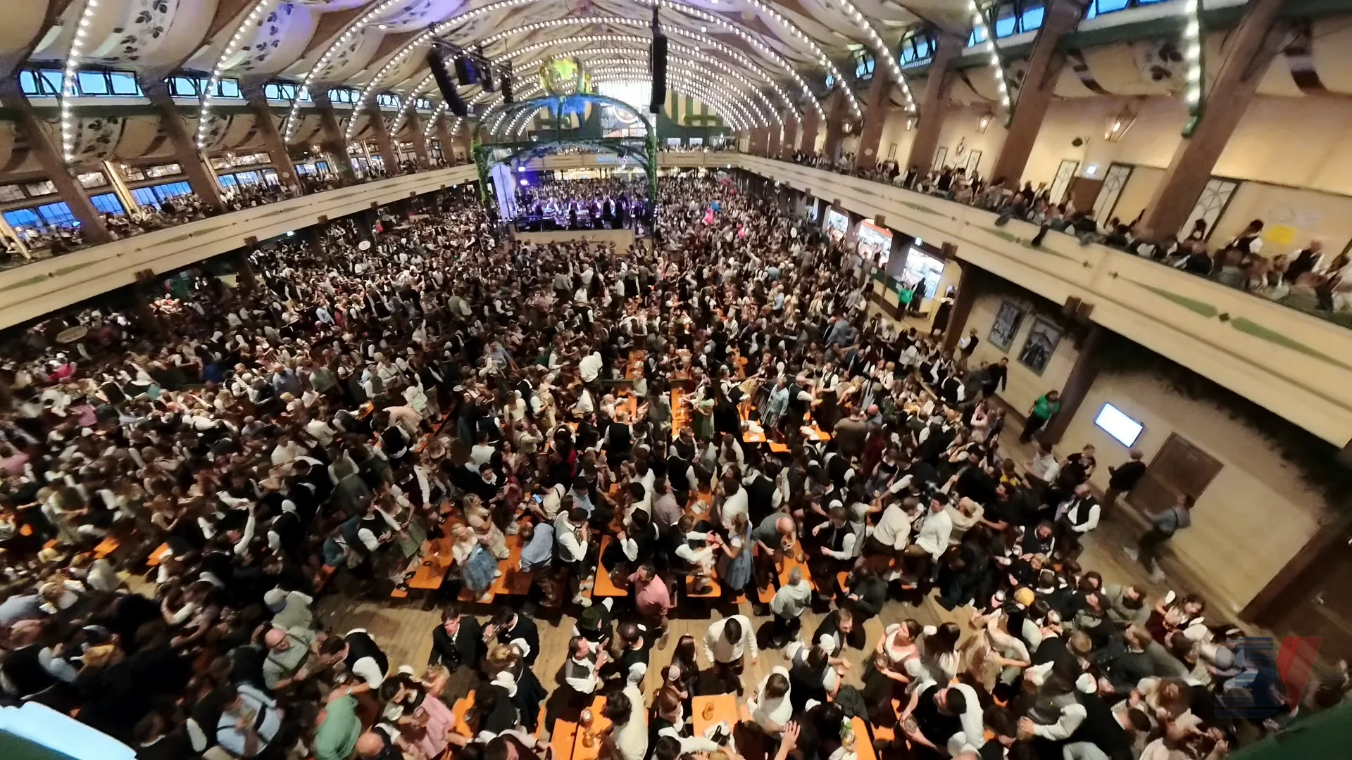 A large crowd enjoying the Oktoberfest festivities inside Bräurosl tent.